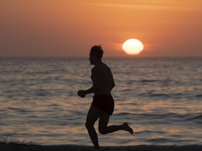 This runner was up with the sun at Bondi Beach, before it got too hot. Picture: Brook Mitchell/Getty Images