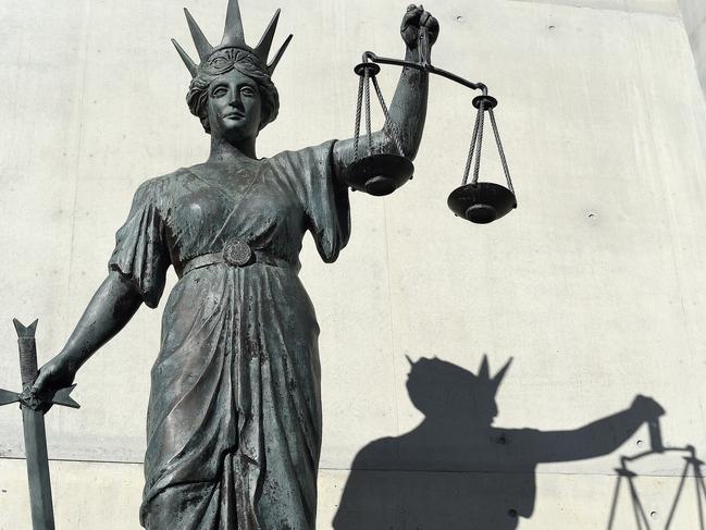 A statue of Themis, the Greek God of Justice stands outside the Supreme Court in Brisbane, Thursday, Oct. 20, 2016. (AAP Image/Dave Hunt) NO ARCHIVING