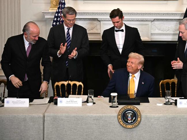 TOPSHOT - US President Donald Trump (2R), flanked by US Secretary of Commerce Howard Lutnick (L), US Secretary of Treasury Scott Bessent (2L) and White House AI and Crypto Czar David Sacks (R), attends a the White House Crypto Summit in Washington, DC, March 7, 2025. (Photo by Jim WATSON / AFP) / ALTERNATE CROP