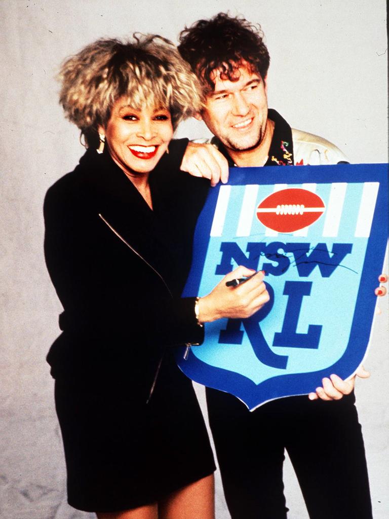 Singer Tina Turner holding emblem / logo with Jimmy Barnes in promotion for NSW RL advertisement. Picture: Action Photographics