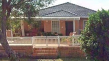 The Georges River planning panel will determine an application to change a two-storey brick house at 50 Lily Street into an eight-room boarding house at a cost of $224,994. Picture: Google Maps