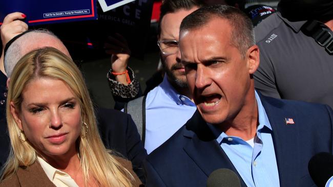 Trump campaign adviser Corey Lewandowski, with former Florida Attorney-General Pam Bondi (L), speaks outside the Pennsylvania Convention Center in Philadelphia, Pennsylvania at the weekend. Picture: AFP.