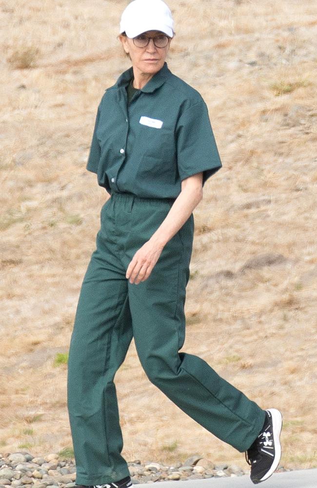 First pictures of convicted felon, Felicity Huffman seen wearing a prison jumpsuit while serving out her sentence on federal charges. Picture: SplashNews.com