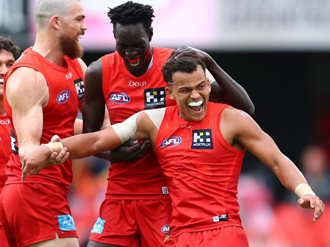 GOLD COAST, AUSTRALIA - MAY 31: Leo Lombard of the Suns celebrates with team mates after kicking a goal during the round 12 AFL match between Gold Coast Suns and Fremantle Dockers at People First Stadium, on May 31, 2025, in Gold Coast, Australia. (Photo by Chris Hyde/Getty Images)