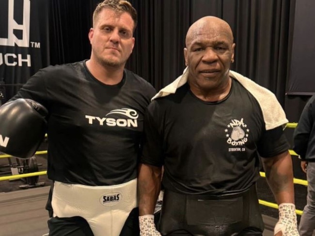 Mike Tyson has been knocking teeth out during sparring, says Mike Russell (L).