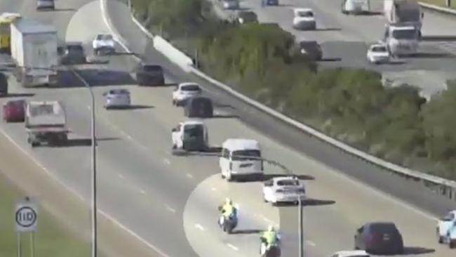 Police motorbikes pursuing the stolen ute on the M1.