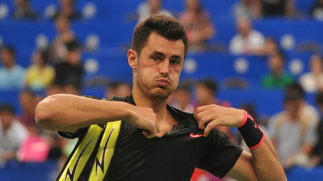 Bernard Tomic of Australia prepares to leave the court after he lost to Kyle Edmund of Britain during their men's singles first round match at the ATP Chengdu Open tennis tournament in Chengdu, China's southwestern Sichuan province on September 26, 2017. / AFP PHOTO / STR / China OUT