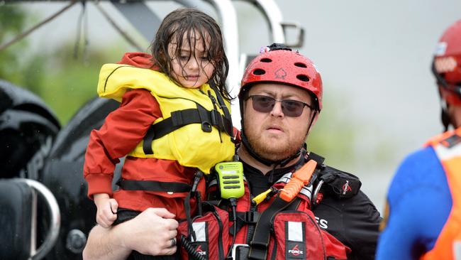 Families rescued from their Upper Colo home. Picture: NCA NewsWire / Jeremy Piper