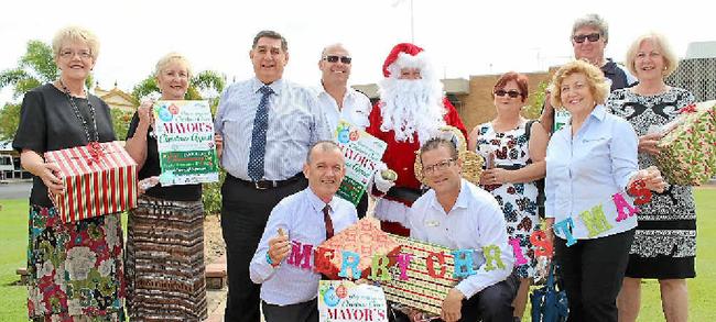 CHRISTMAS APPEAL: Cr Judy Peters, Bundaberg Broadcaster’s Trish Mears, Cr Mal Forman, Salvation Army’s Chris Millard, Santa Claus (Cr Tony Ricciardi), St Vincent de Paul’s Kim and Barry Kirby and Cr Lynne Forgan, (from left, front) Cr Vince Habermann, Cr David Batt, St Vincent de Paul’s Angela Vicenzotti launch the 2015 Mayor’s Christmas Appeal. Picture: Contributed