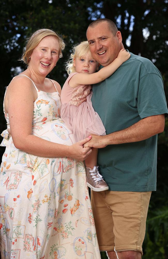 Chelsea Allan, 35, with husband Paul and daughter Lola, 2. She is due to give birth to Hudson, who has been possible through IVF. Picture: Adam Head