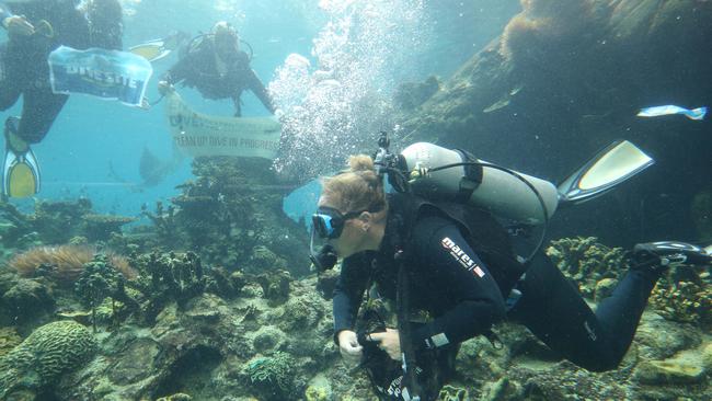 Sea World divers joined the Environmental Divers on a mock clean-up at Shark Bays Tropical Reef Pool in preparation for the real thing in Gold Coast waterways. Picture: Glenn Hampson