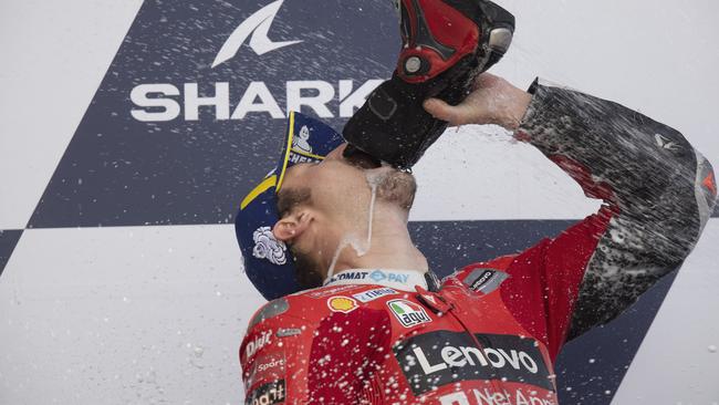 LE MANS, FRANCE - MAY 16: Jack Miller celebrates victory on the podium and drinks champagne from a boot in Le Mans, France. (Photo by Mirco Lazzari gp/Getty Images)