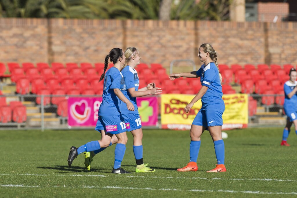 South West Queensland Thunder celebrate a Chloe Hutton (centre) goal against Mudgeeraba Soccer Club in NPL Queensland women round 24 football at Clive Berghofer Stadium, Saturday, August 11, 2018. Picture: Kevin Farmer