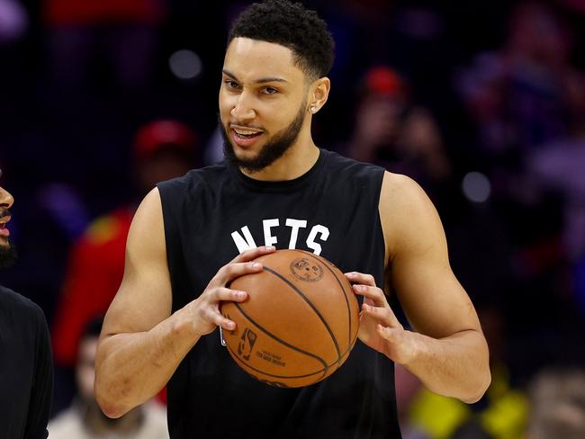 PHILADELPHIA, PENNSYLVANIA - MARCH 10:  Patty Mills #8 and Ben Simmons #10 of the Brooklyn Nets take the court for warm ups before the game against the Philadelphia 76ers at Wells Fargo Center on March 10, 2022 in Philadelphia, Pennsylvania. NOTE TO USER: User expressly acknowledges and agrees that, by downloading and or using this photograph, User is consenting to the terms and conditions of the Getty Images License Agreement. (Photo by Elsa/Getty Images)