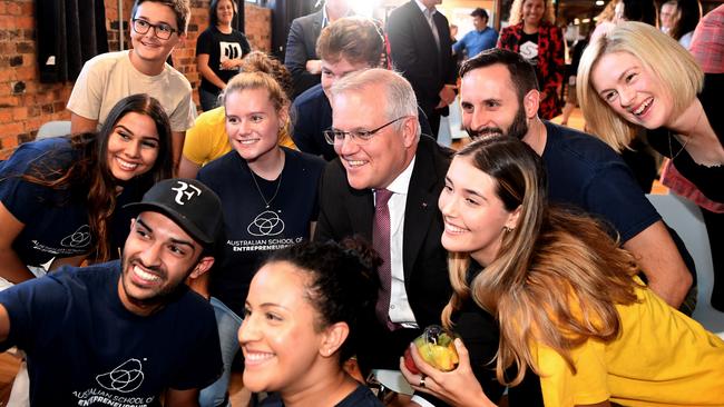 Australian Prime Minister Scott Morrison and Queensland Senator Amanda Stoker (far right) pose for a group selfie during a Women Enterprising event at River City Labs in Brisbane. Picture: NCA NewsWire / Dan Peled