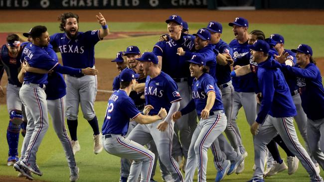 PHOENIX, ARIZONA - NOVEMBER 01: The Texas Rangers celebrate after beating the Arizona Diamondbacks 5-0 in Game Five to win the World Series at Chase Field on November 01, 2023 in Phoenix, Arizona. (Photo by Sean M. Haffey/Getty Images) *** BESTPIX ***