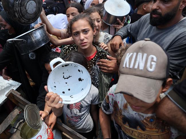 Palestinian children gather at a hot meal distribution point in Nuseirat in the central Gaza Strip. Picture: AFP