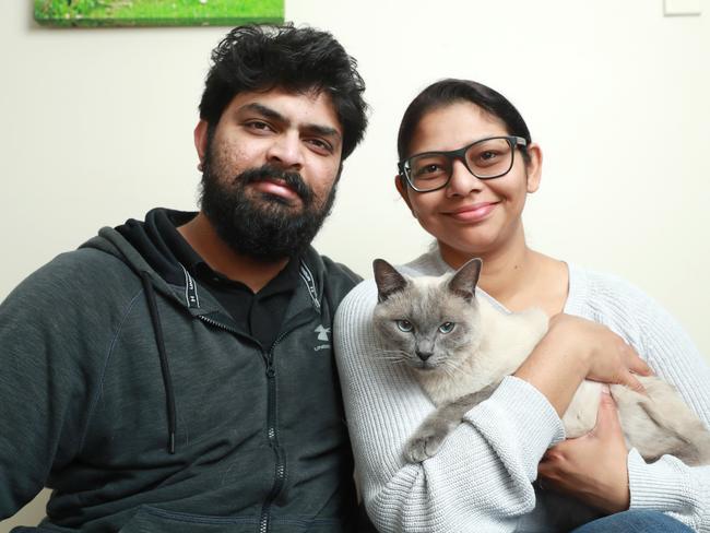 29/8/22: Jotyshna Khan and husband Imraaz Khan with Zeus, 1 year and 8 month old Burmese at their home at Kingswood near Penrith. Zeus is recovering from Ã¢â¬ËCat CovidÃ¢â¬â¢. John Feder/The Daily Telegraph.