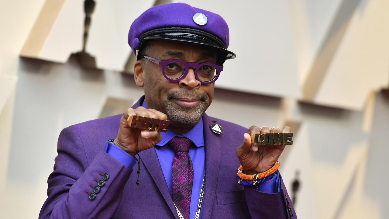 Spike Lee holds up brass knuckles reading "hate" and "love" from his iconic film "Do The Right Thing". Picture: AP