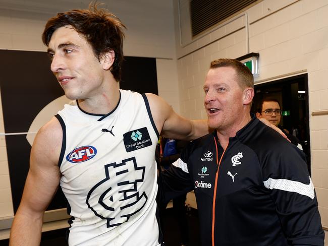 MELBOURNE, AUSTRALIA - AUGUST 6: Caleb Marchbank of the Blues and Michael Voss, Senior Coach of the Blues celebrate during the 2023 AFL Round 21 match between the St Kilda Saints and the Carlton Blues at Marvel Stadium on August 6, 2023 in Melbourne, Australia. (Photo by Michael Willson/AFL Photos via Getty Images)