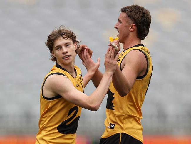 PERTH, AUSTRALIA - JUNE 23: Cody Angove and Bo Allan of Western Australia celebrate a goal during the Marsh AFL National Championships match between U18 Boys Western Australia and Victoria Metro at Optus Stadium on June 23, 2024 in Perth, Australia. (Photo by Paul Kane/AFL Photos/via Getty Images)