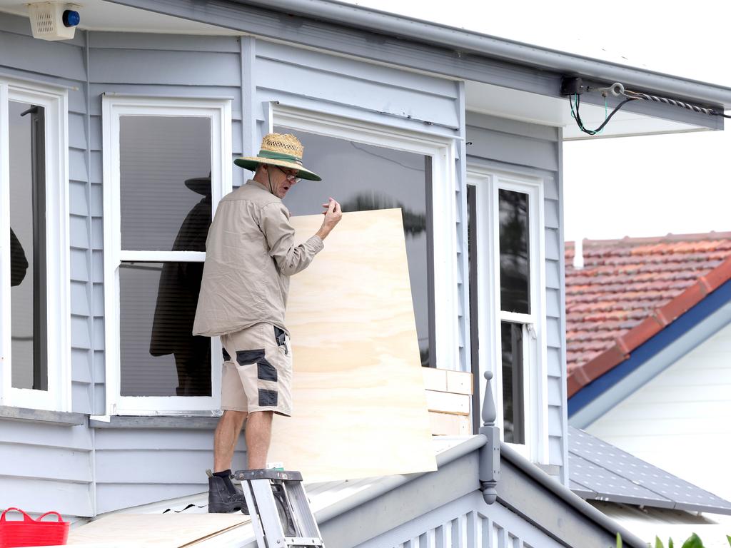 Toni Stachelek, protects a large window on Kennedy Esplanade Scarborough. Photo Steve Pohlner