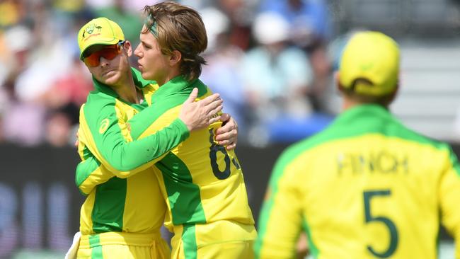 Australia's Steve Smith and Adam Zampa during their World Cup match against Afghanistan. Picture: AFP