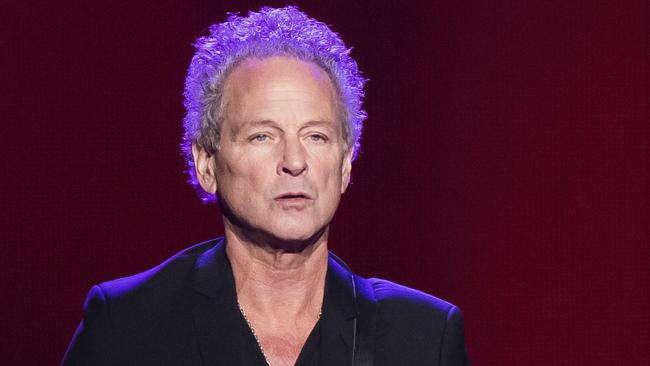 FILE - In this Oct. 6, 2014 file photo, Lindsey Buckingham from the band Fleetwood Mac performs at Madison Square Garden in New York. The band said in a statement Monday that Buckingham is out of the band for its upcoming tour. Buckingham left the group once before, from 1987 to 1996.  Heâ€™ll be jointly replaced by Neil Finn of Crowded House and Mike Campbell of Tom Petty and the Heartbreakers.  (Photo by Charles Sykes/Invision/AP, FIle)