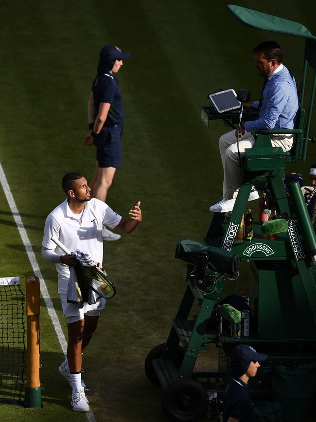 Australia’s Nick Kyrgios (left) exchanges words with umpire Damien Dumusois. Picture: AFP