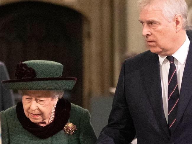 Britain's Queen Elizabeth II (L) and Britain's Prince Andrew, Duke of York, arrive to attend a Service of Thanksgiving for Britain's Prince Philip, Duke of Edinburgh, at Westminster Abbey in central London on March 29, 2022. - A thanksgiving service will take place on Tuesday for Queen Elizabeth II's late husband, Prince Philip, nearly a year after his death and funeral held under coronavirus restrictions. Philip, who was married to the queen for 73 years, died on April 9 last year aged 99, following a month-long stay in hospital with a heart complaint. (Photo by RICHARD POHLE / POOL / AFP)