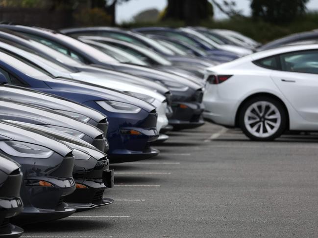 (FILES) Brand new Tesla cars are displayed on the sales lot at a Tesla dealership on May 16, 2023 in Colma. Electric car maker Tesla has initiated a recall of about two million vehicles in the United States over a risk linked to its autopilot software, the US traffic safety regulator said on December 13, 2023. 