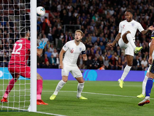 England's midfielder Raheem Sterling (3R) watches the ball after heading to score the equalising goal during the UEFA Euro 2020 qualifying Group A football match between England and Kosovo at St Mary's stadium in Southampton, southern England on September 10, 2019. (Photo by Adrian DENNIS / AFP) / NOT FOR MARKETING OR ADVERTISING USE / RESTRICTED TO EDITORIAL USE