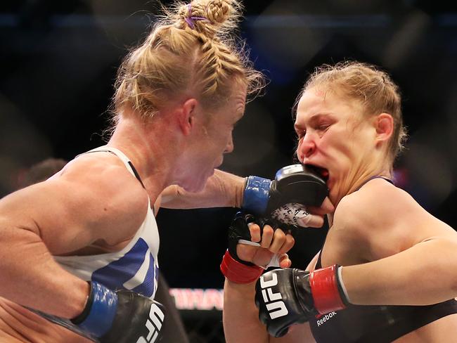 MELBOURNE, AUSTRALIA - NOVEMBER 15: Ronda Rousey of the United States (R) and Holly Holm of the United States compete in their UFC women's bantamweight championship bout during the UFC 193 event at Etihad Stadium on November 15, 2015 in Melbourne, Australia. (Photo by Quinn Rooney/Getty Images)