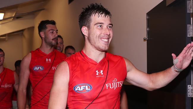 ADELAIDE, AUSTRALIA – APRIL 15: Zach Merrett of the Bombers leads his team into the change rooms after the win during the 2023 AFL Round 05 match between the Essendon Bombers and the Melbourne Demons at Adelaide Oval on April 15, 2023 in Adelaide, Australia. (Photo by Sarah Reed/AFL Photos via Getty Images)