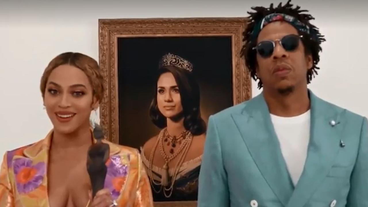 Beyonce and Jay-Z in front of Meghan Markle's portrait.