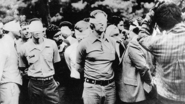 The first day of occupation of the US Embassy in Tehran shows American hostages being paraded by their militant Iranian captors. Picture: Supplied