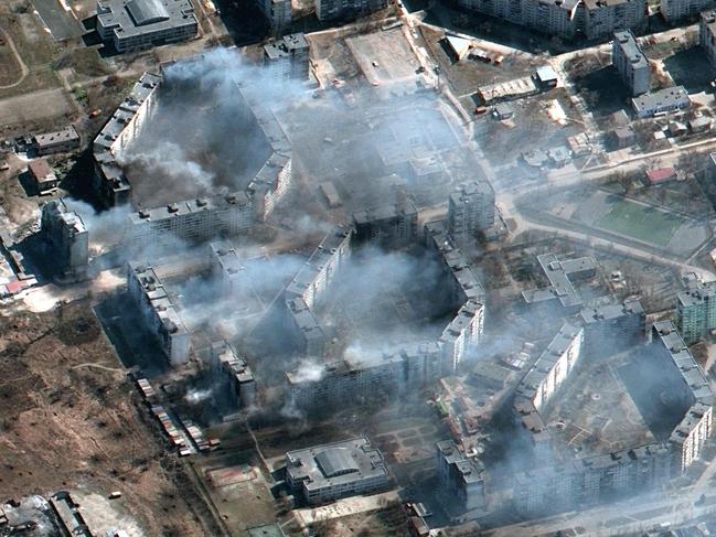 This Maxar satellite image taken on March 19, 2022 and released on March 21, 2022 shows burning apartment buildings, "likely shelled by artillery" and burning buildings in northeastern Mariupol, Ukraine. Picture: Satellite image Â©2022 Maxar Technologies / AFP