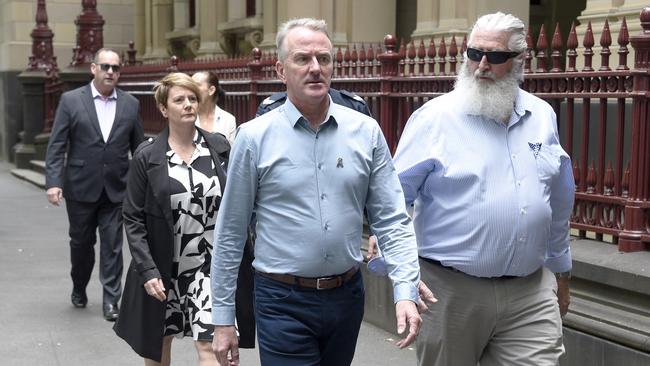 Family of the police killed in the Eastern Freeway crash arrive at the Supreme Court. Picture: Andrew Henshaw