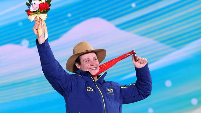 Bronze medal winner Ben Tudhope celebrates on the podium during the medal ceremony.