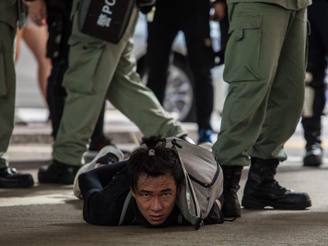 A protester is detained in July 2020. Australia has labelled mass arrests in Hong Kong an attempt to ‘eliminate dissent’ under the country’s national security law. . Picture: Dale De La Rey/ AFP