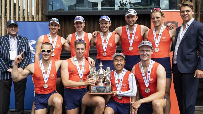 The Sydney University Boat Club men's team with the Australian Boat Race trophy. Picture: Tobias Titz