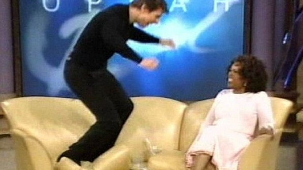 Tom Cruise jumps on the couch during an appearance on Oprah in 2005, after proclaiming his love for actor Katie Holmes. Picture: Supplied