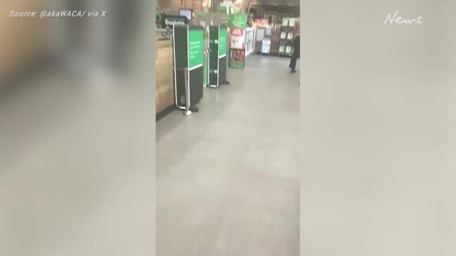 'Imprisoned': Woolies checkout gate smashed