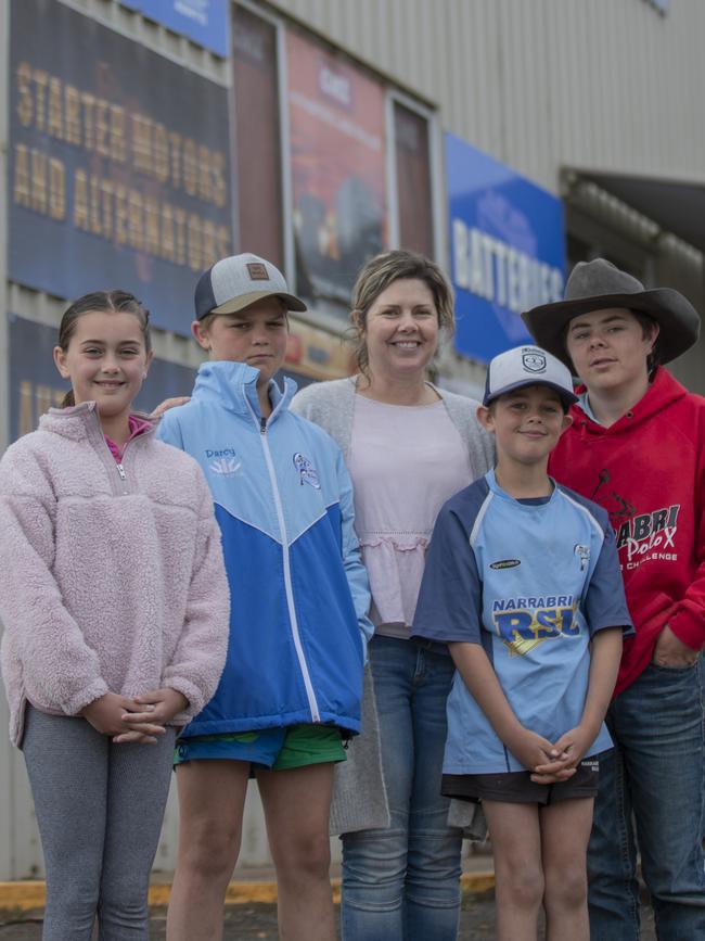 Cassie Dickinson (centre) and her four children.