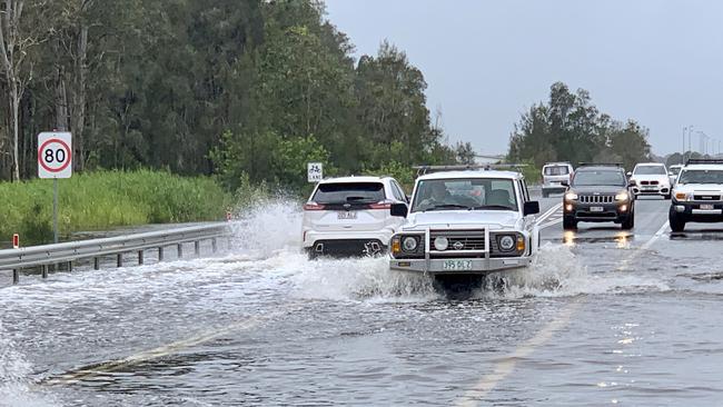 Motorists driving through the rain on David Low Way at Bli Bli. Photo: Patrick Woods