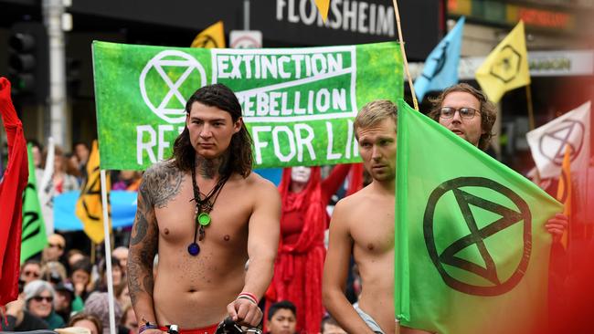 Extinction Rebellion activists block an intersection in Melbourne. Picture: James Ross/AAP.