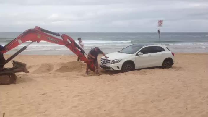 Car beached at Dee Why