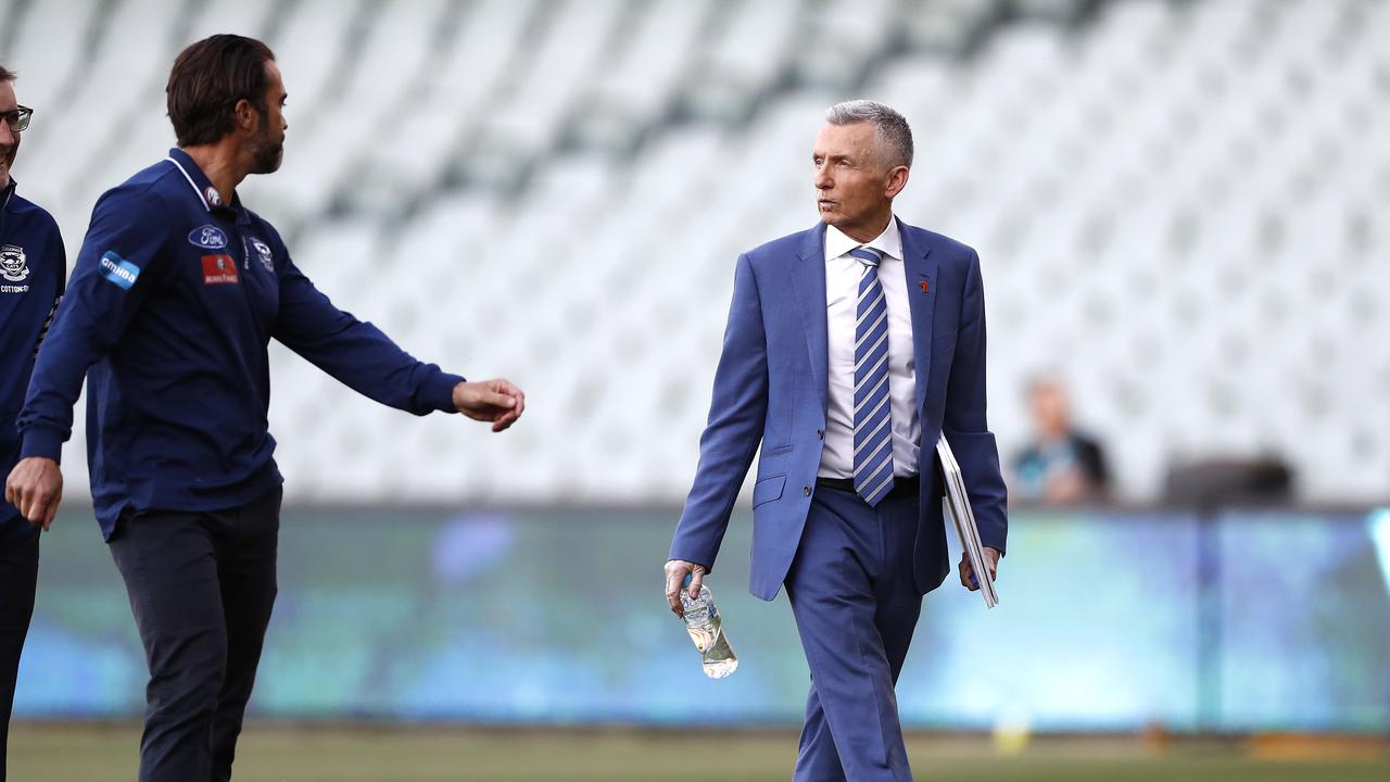 Bruce McAvaney speaks with Geelong coach Chris Scott before the first qualifying final. (Photo by Ryan Pierse/Getty Images)