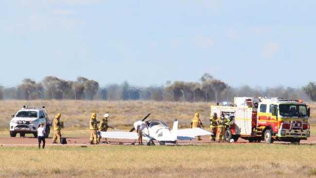 Firefighters at scene of plane fire on side of Landsborough Highway at Longreach Airport. Photo by Greg Weir / CQ Plane Spotting Blog