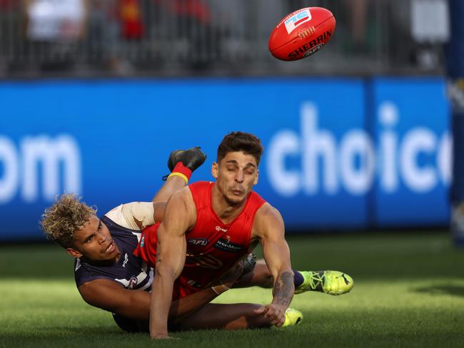 Liam Henry of the Dockers tackles Sean Lemmens of the Suns. Picture: Getty